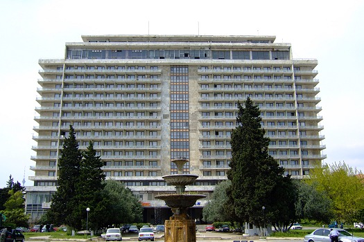 The second hotel we tried out was the Azerbaijan Inturist hotel - at least that was what was written on the facade of the building. We tried to call this hotel several times from Moscow but never got through to anybody there. Actually we where told that it was closed for reconstruction or even demolition, therefore we were quite astonished to see that we could actually get access to the hotel. By the entrance a policeman was standing and asking us what we wanted. We told him that we needed a room for the next day. That was absolutely no problem, he asked of our price range and asked us to follow him to the elevator. The panel in the elevator was half destroyed but we were lifted all 11 floors up without a glitch. A lady was sitting in hall of the floor and the policeman spoke a bit with her. She gave him a key and he followed us to our soon to become room. It was destroyed but at least clean and with a good view over the bay so we paid the policeman and got an old Inturist access card by the lady before we went away.