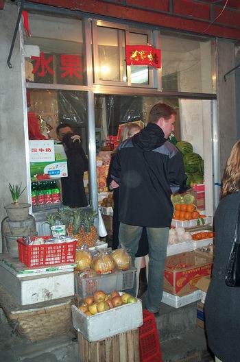 Beijing is the city of contradictions. Here we are about a kilometer from the Oriental Plaza buying some beers in a local store. We bought all the store keepers Yangjing beer, so he had to run down the street to get some more:-)