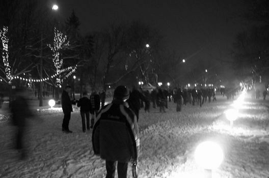 Gorky Park is in the winter a huge ice rink because all the paths are covered with ice. Here I have captured a Russian enjoying his spare time skating and drinking a very cold beer.