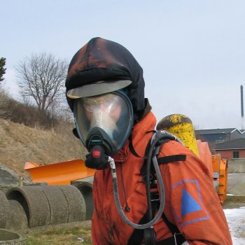 Anders ready to enter a burning building with fire fighter clothing on.