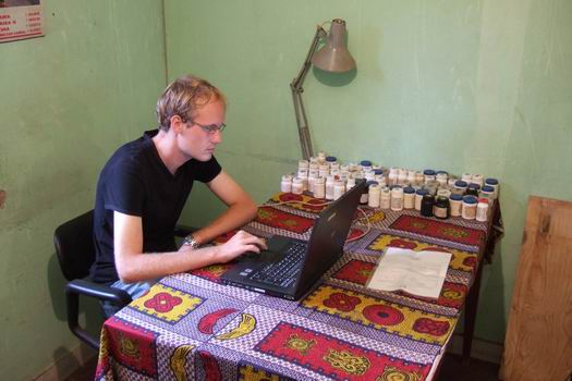 Morten sitting in his office at the Bandim Health Project's "headquarters" - the money is being used on science and not on nice offices. I do not think there was a single electrical installation which would comply with any European standard on their premises - or maybe even the country:-)